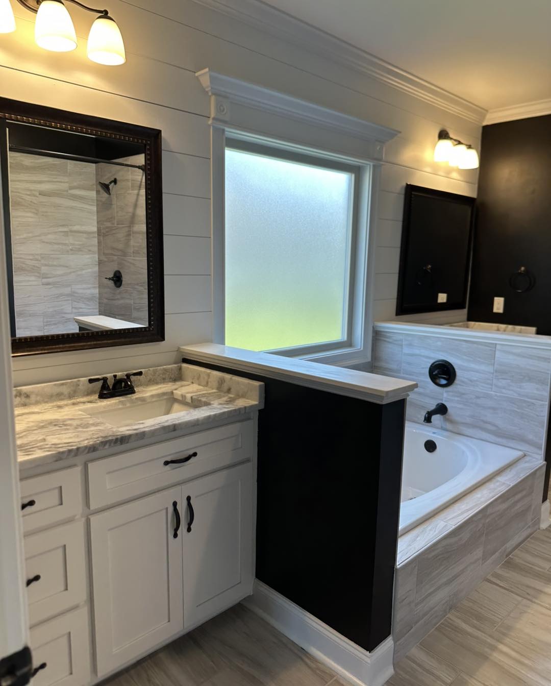 Sparkling clean bathroom with tub and vanity