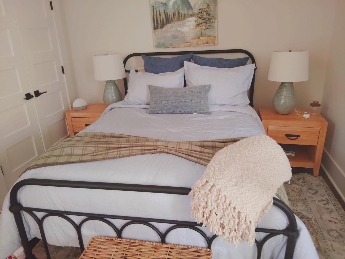 Freshly made bedroom after cleaning service