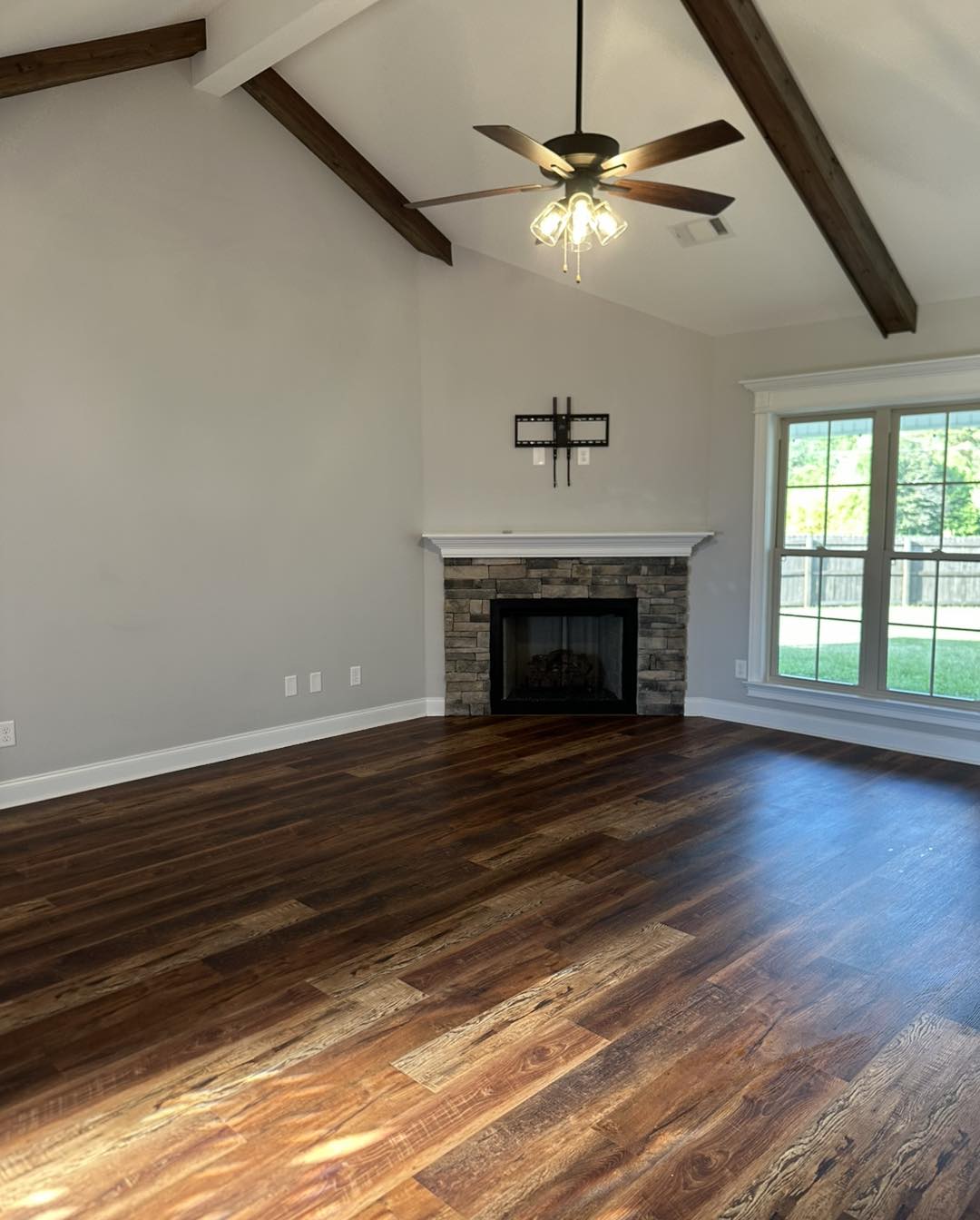 Clean living room with gleaming hardwood floors