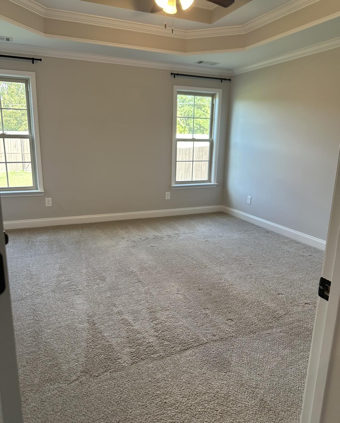 Clean carpeted room ready for move-in